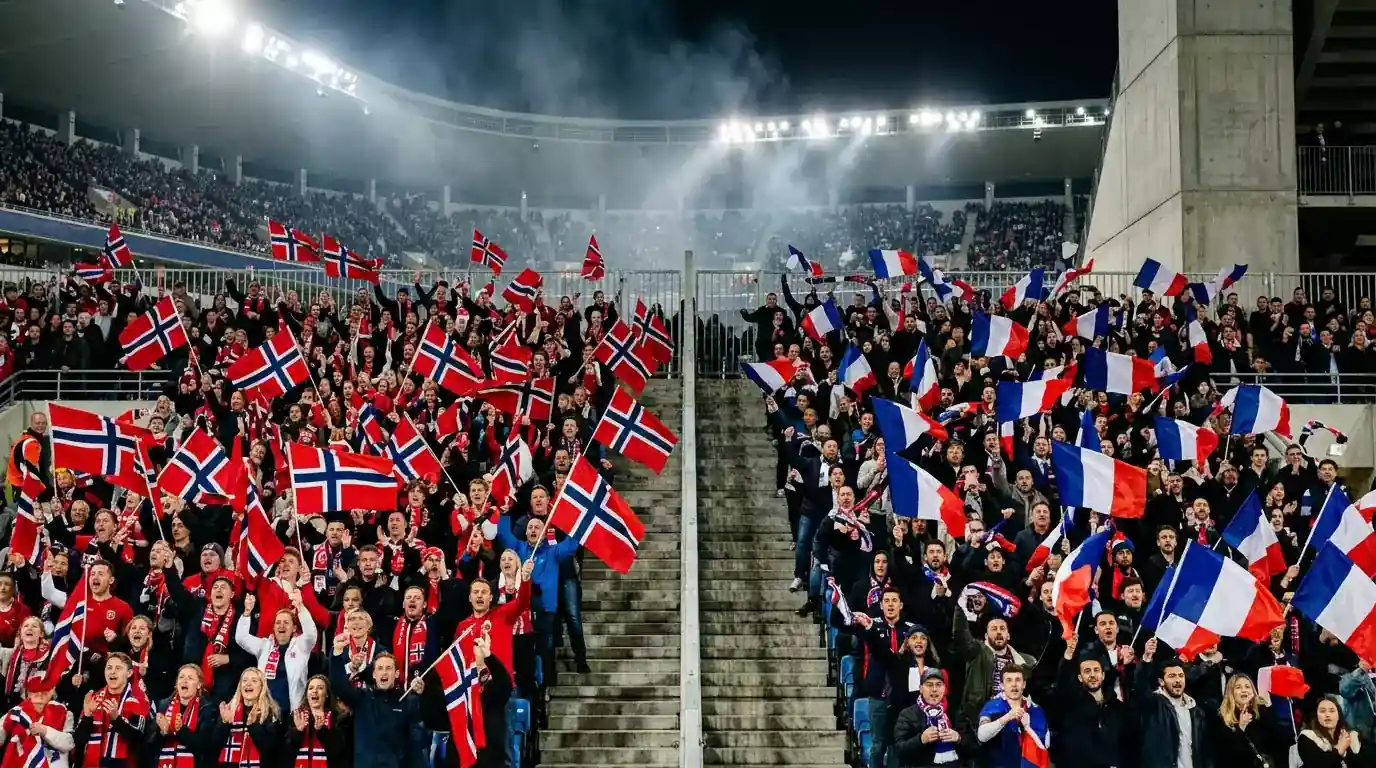 Norske og franske flag side om side på et stadiontribune før kampstart